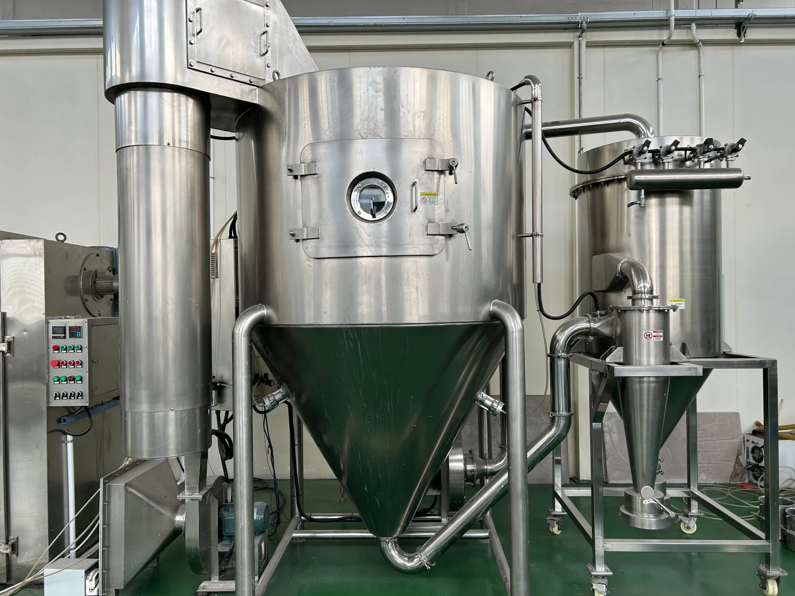 Pilot-scale spray dryer with cyclone separator used to establish drying parameters on small material quantities